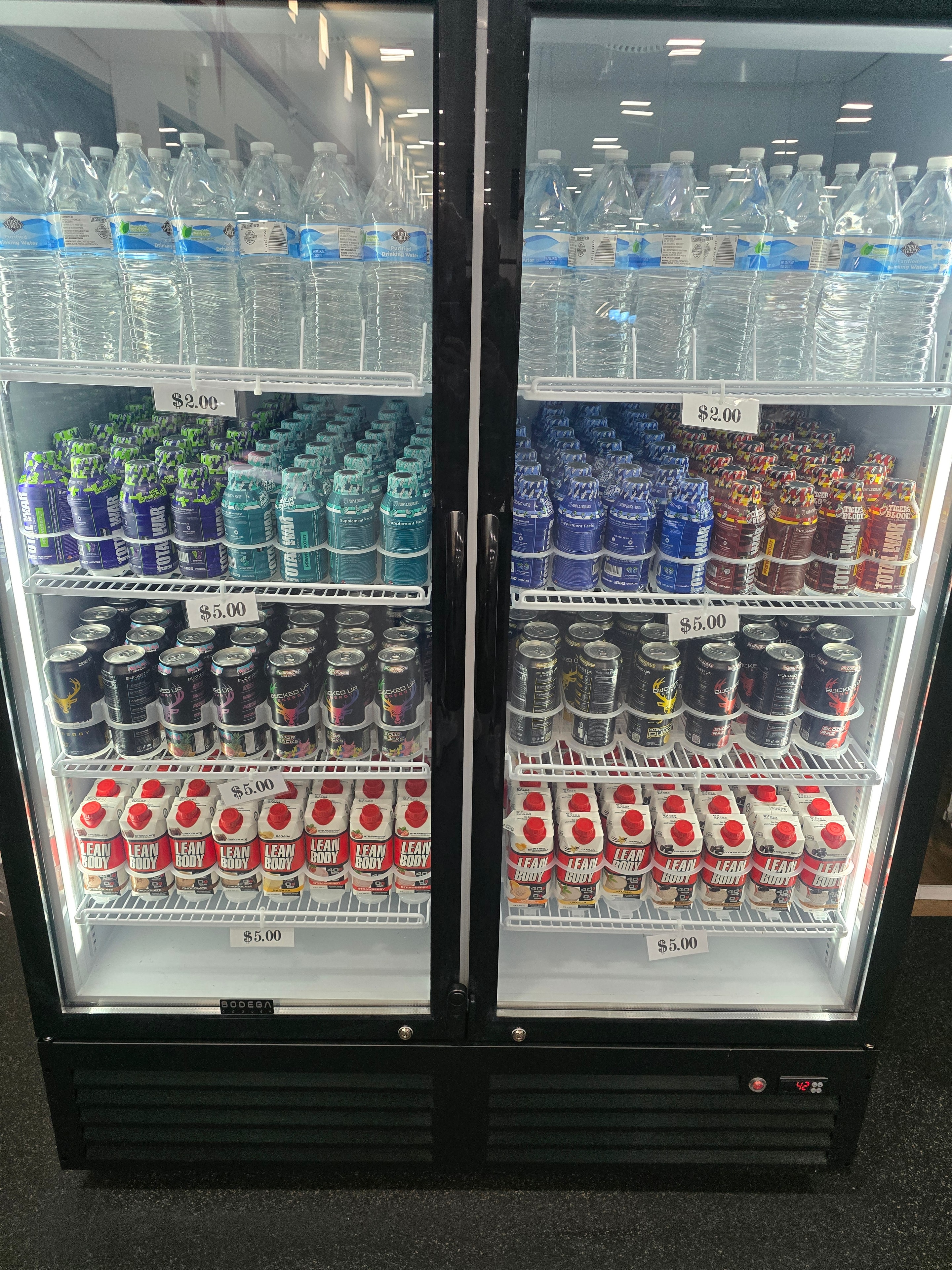Refrigerated display case stocked with RTD beverages